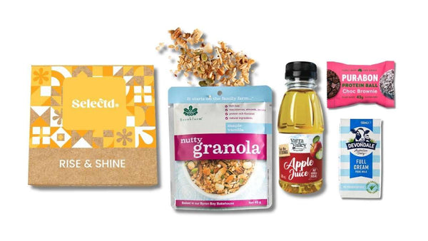 Premium Rise & Shine breakfast pack with Brookfarm nutty granola, Devondale milk, Yarra Valley Hilltop apple juice and a Purabon choc brownie protein ball